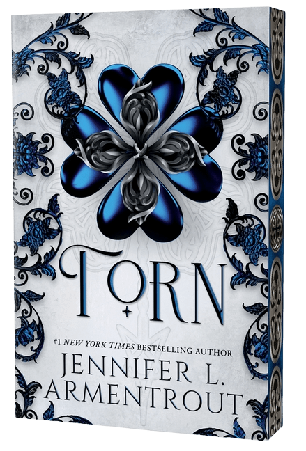 Book cover of 'Torn' by Jennifer L. Armentrout with decorative blue flower design on a white background