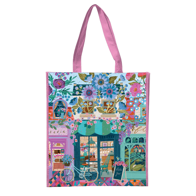 Colorful tote bag with a floral and street scene design on a white background