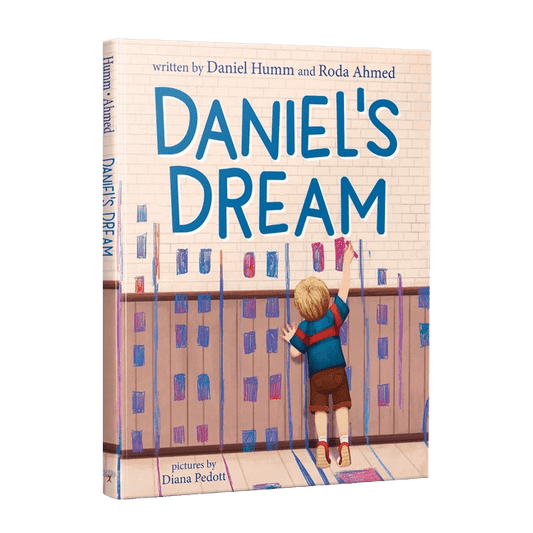 Book cover of 'Daniel's Dream' with a child painting on a wall.